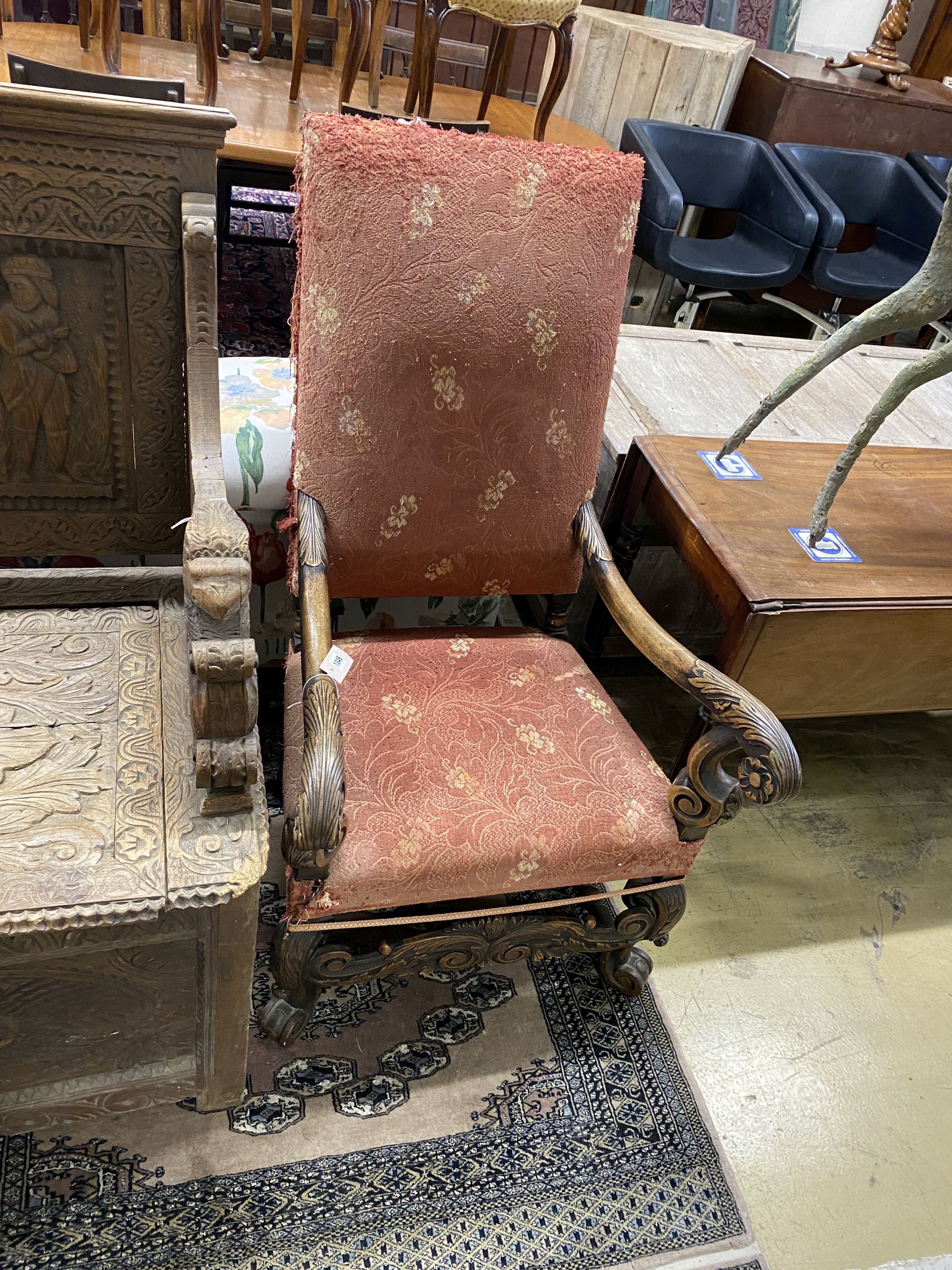 An 18th century style carved walnut elbow chair, width 64cm, depth 62cm, height 116cm